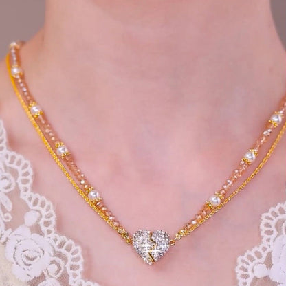 Matchande halsband med magnetiskt delat hjärta och hänge